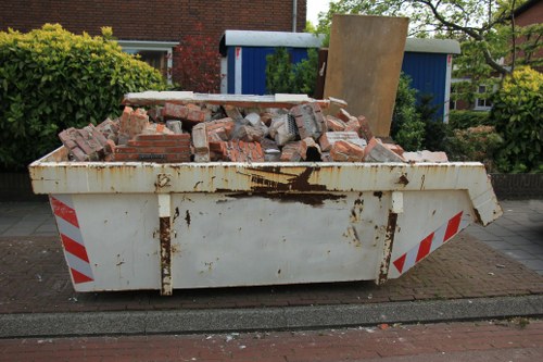 Waste collection trucks operating in East London streets