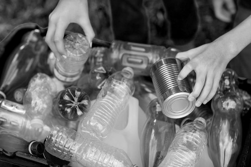 Workers sorting builders waste materials for recycling