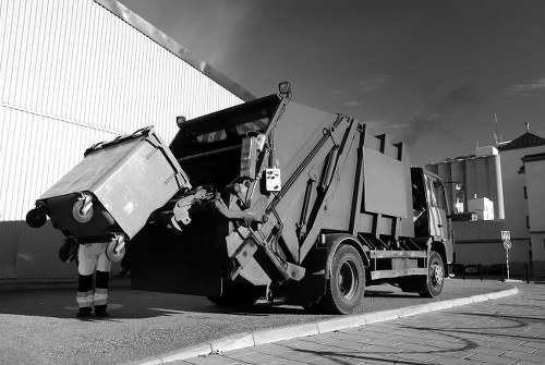 Rubbish collection truck operating in East London streets