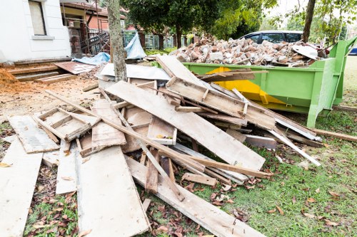 A professional garden clearance team working in an East London garden