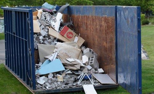 Workers managing construction waste materials in Clapton