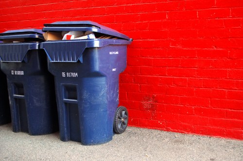 A clean construction site in Upper Walthamstow with organized waste containers