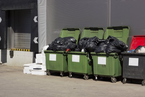 Workers sorting construction waste at a recycling center